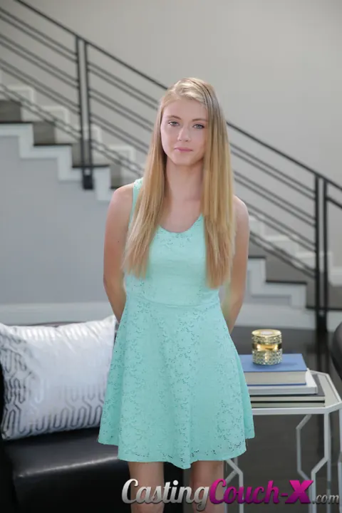 Hannah Hays: Slim Blonde Strips and Fingers Her Pussy on the Sofa – photo 1 of 16