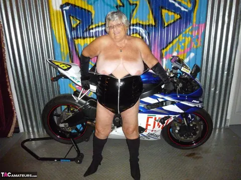 European Brunette with Big Tits Poses in Motorcycle Boots and Glasses – photo 8 of 20