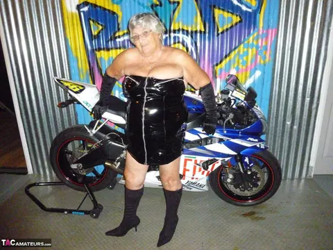 European Brunette with Big Tits Poses in Motorcycle Boots and Glasses – photo 1 of 20