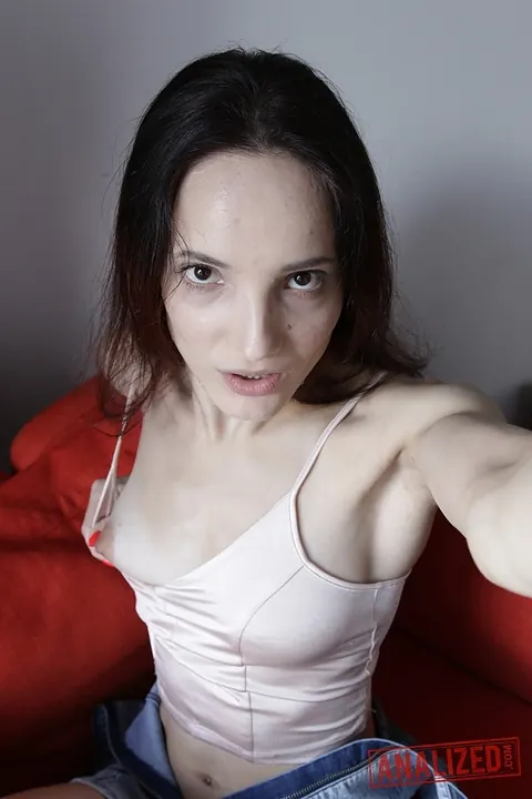Mia Sanders: Skinny Russian Brunette Pulls Panties Aside and Spreads Her Pussy on the Sofa – photo 12 of 20