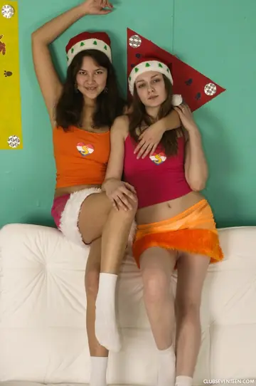 Two Women in Uniforms and Socks Kiss and Spread for Each Other
