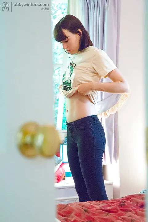 Tall Brunette Pulls on Jeans and Panties – photo 16 of 16