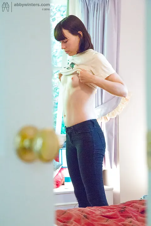 Tall Brunette Pulls on Jeans and Panties – photo 15 of 16