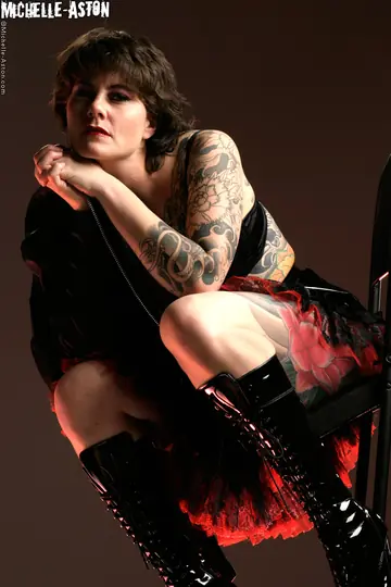 Tall Tattooed MILF in Heels and Boots Bares Her Small Tits