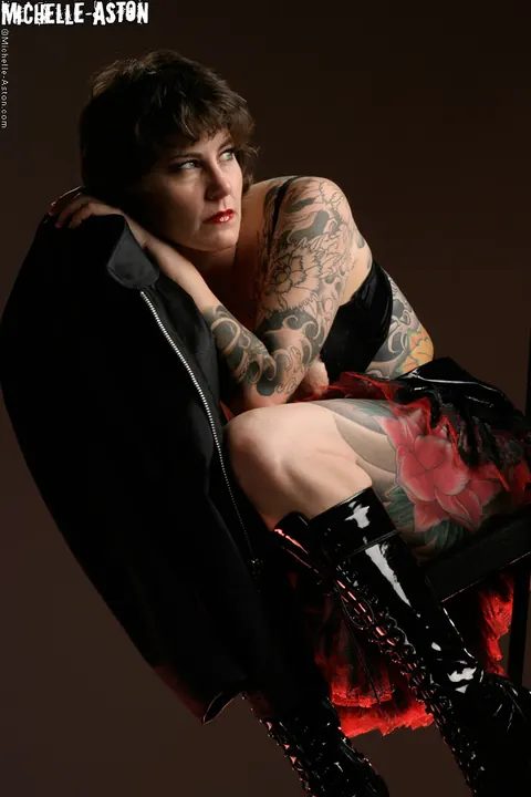 Michelle Aston: Tall Tattooed MILF in Heels and Boots Bares Her Small Tits – photo 8 of 14
