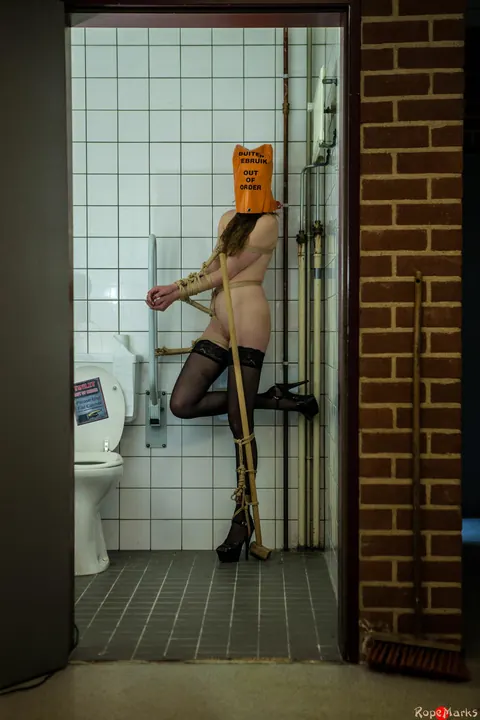 Bound and Blindfolded Woman in Stockings and Heels in the Bathroom – photo 11 of 16