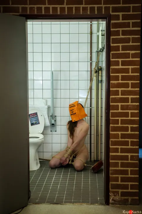 Bound and Blindfolded Woman in Stockings and Heels in the Bathroom – photo 9 of 16