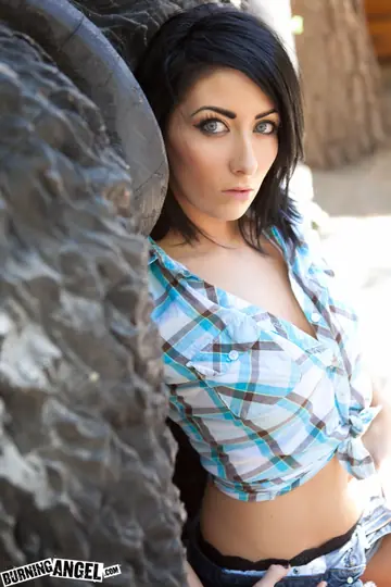 Short-Haired Brunette Kneels Outdoors and Fingers Her Pussy