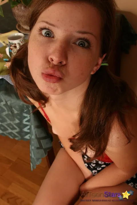 Brunette in a Skirt Tugs Her Pigtails and Strips Nude – photo 11 of 15