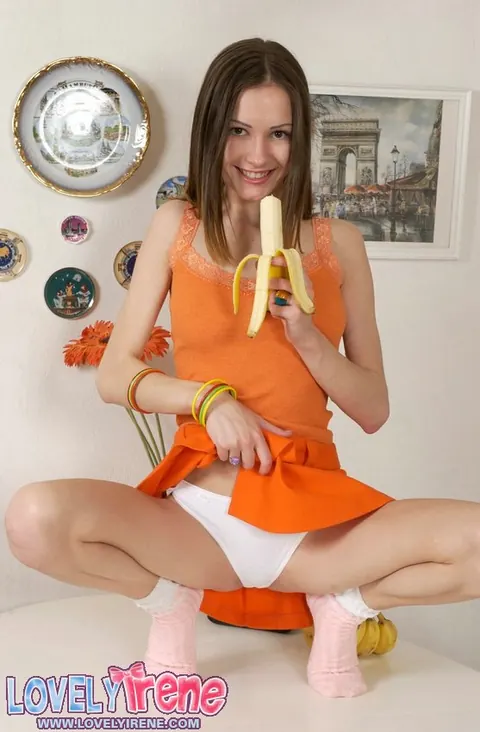 Lovely Irene: Slim Brunette Peels a Banana in Panties and Socks – photo 6 of 15