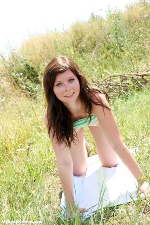 Redhead Masturbates with a Toy on the Grass by a Dirt Road – photo 3 of 16