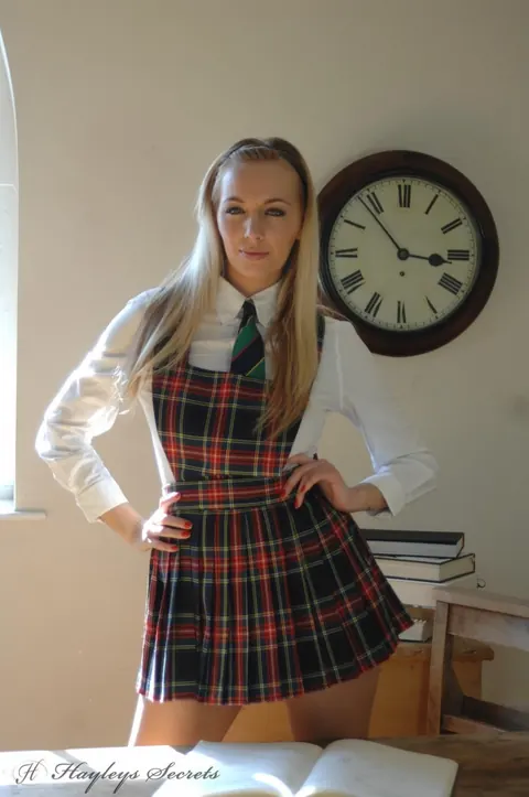 Hayley Marie Coppin: British Blonde in Uniform Skirt and Heels Spreads Her Legs – photo 5 of 12