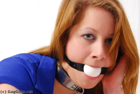 Redhead in Jeans and High Heels Ball-Gagged and Grasping Ankles – photo 15 of 16