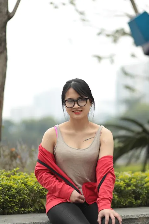 Asian Brunette in Glasses Poses Outdoors – photo 3 of 21