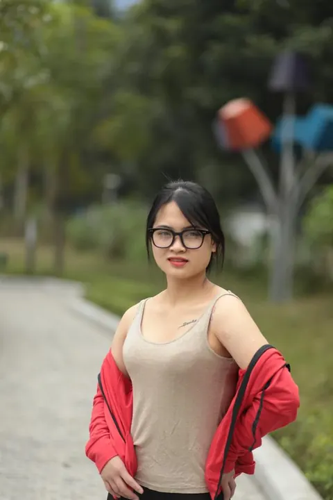 Asian Brunette in Glasses Poses Outdoors – photo 9 of 21