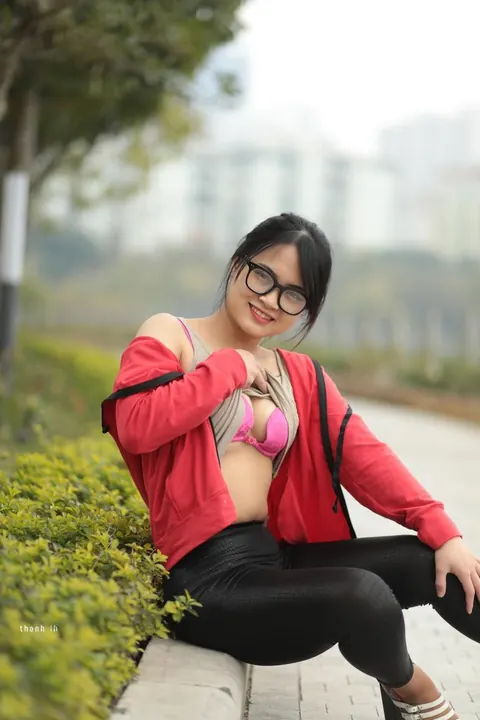 Asian Brunette in Glasses Poses Outdoors – photo 11 of 21