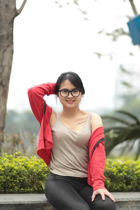 Asian Brunette in Glasses Poses Outdoors – photo 2 of 21