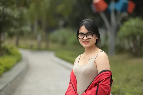 Asian Brunette in Glasses Poses Outdoors – photo 10 of 21