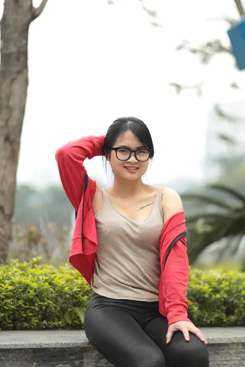 Asian Brunette in Glasses Poses Outdoors – photo 21 of 21