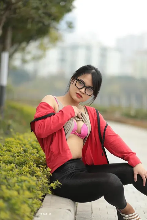 Asian Brunette in Glasses Poses Outdoors – photo 12 of 21