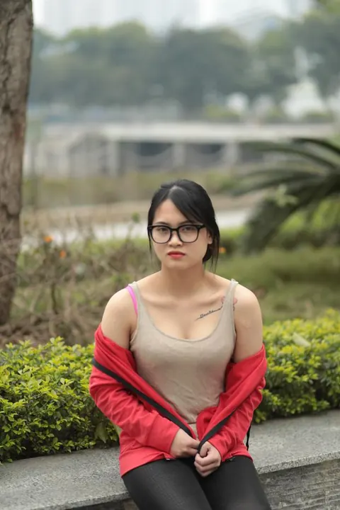 Asian Brunette in Glasses Poses Outdoors – photo 4 of 21