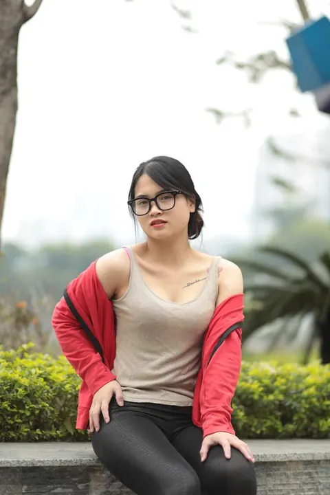 Asian Brunette in Glasses Poses Outdoors – photo 20 of 21