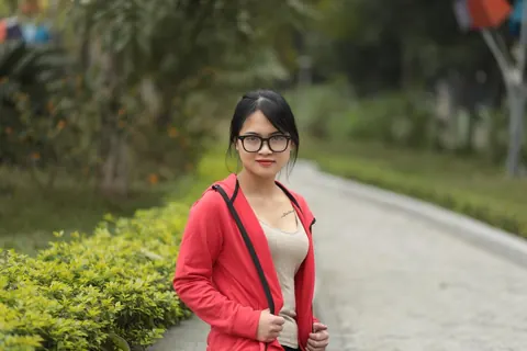Asian Brunette in Glasses Poses Outdoors – photo 6 of 21