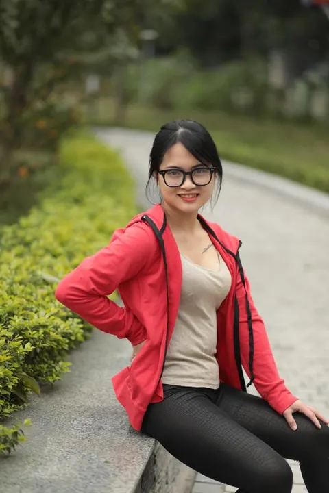 Asian Brunette in Glasses Poses Outdoors – photo 7 of 21