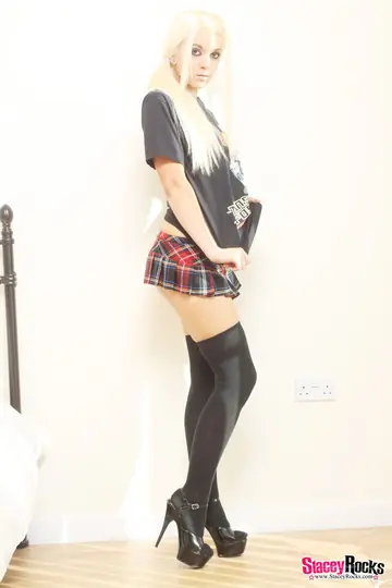 British Blonde Strips Off Her Skirt and Socks While Holding a Lollipop
