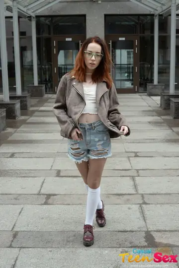 Lottie Magne – Skinny Redhead in Shorts and Glasses Rides Cock on Outdoor Table