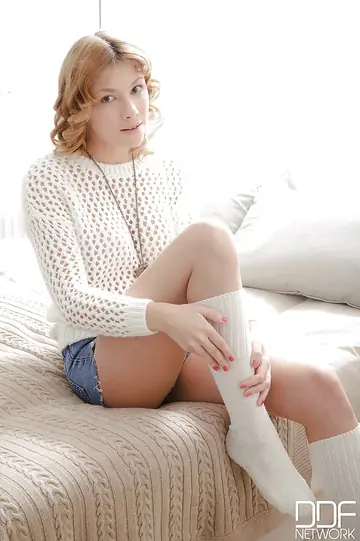 Woman in Shorts and Socks Masturbates Her Hairy Pussy
