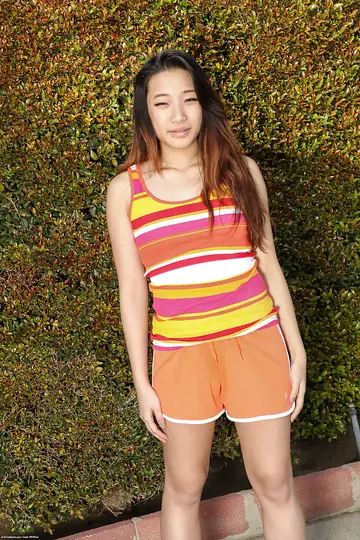 Asian Amateur Strips Out of Her Shorts and Fingers Her Pussy Outside