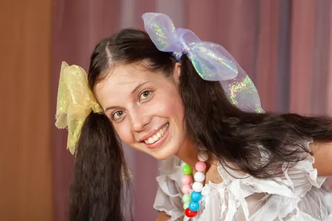 Woman in Pigtails, Shorts and High Heels Poses Playfully – photo 12 of 21
