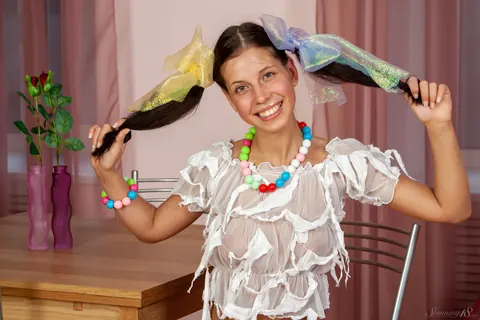 Woman in Pigtails, Shorts and High Heels Poses Playfully – photo 9 of 21