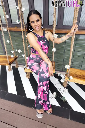 Asian Trans Woman Stands Nude and Poses in Profile View