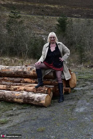 British Blonde Peels Off Her Skirt for Pantyhose and Boots Outdoors
