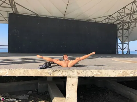 European Brunette Strips Out of Her Panties on a Concrete Stage – photo 6 of 16