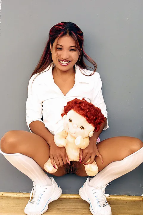 Lyla Lei: Thai Brunette Spreads Her Pussy in a Skirt and Socks – photo 8 of 12