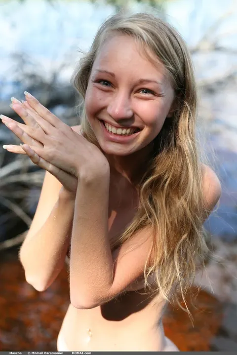 Mature Blonde Wanders Naked into a Watery Marsh and Spreads – photo 15 of 16