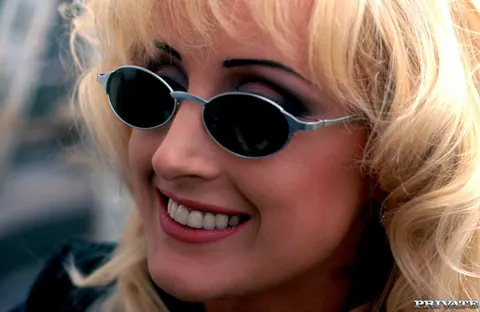Greta Milos: Busty Blonde in Stockings and Glasses Spreads Outdoors – photo 10 of 12