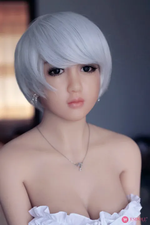 Woman with Enhanced Tits Strips and Poses Nude Front and Back – photo 12 of 15