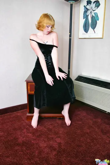 Short-Haired Redhead in a Dress Exposes Her Big Tits
