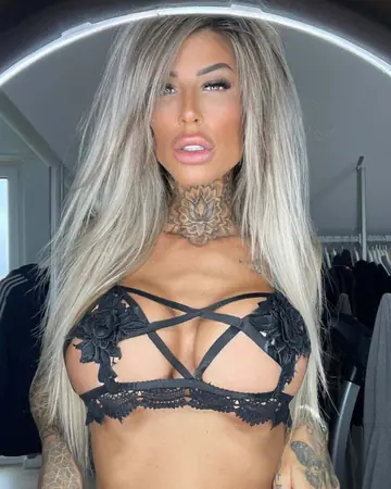 Tattooed Blonde Strips Off Her Lingerie and Poses Nude