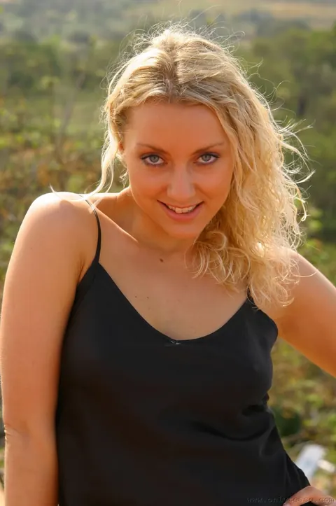 European Woman Poses and Spreads Her Legs Clothed – photo 3 of 21