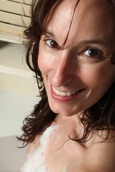 Celeste Carpenter: Brunette MILF with Natural Tits Undresses in the Bathroom – photo 7 of 21