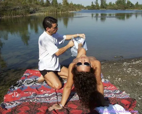 Woman in Shorts and Glasses Takes Two Men Outdoors – photo 8 of 15