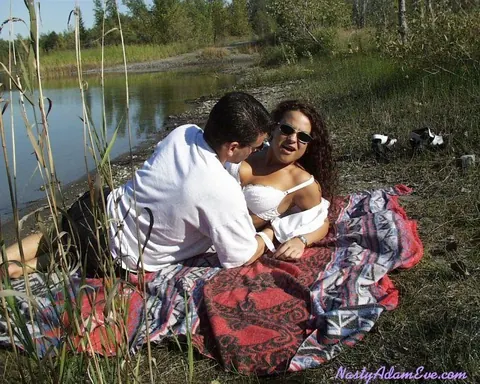 Woman in Shorts and Glasses Takes Two Men Outdoors – photo 4 of 15