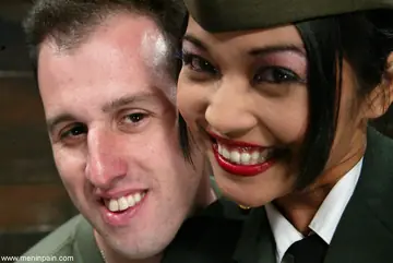 Busty Asian Brunette in a Military Uniform Dominates Soldiers in a Threesome