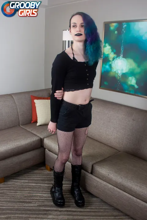 Trans Woman in Fishnet Stockings Strokes Her Cock – photo 2 of 16
