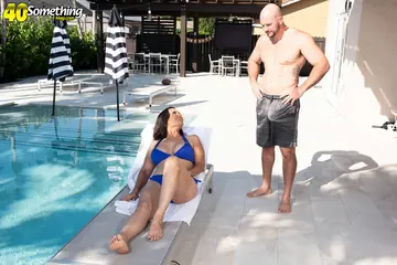 Busty Brunette MILF in a Bikini Gives a Blowjob and Titjob Poolside